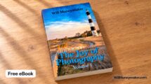 The Joy of Photography, Volume 1 eBook cover displayed on a wooden table with a Free eBook label.