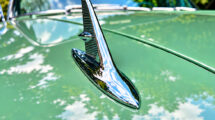 Chrome hood ornament on a vintage green car photographed during a short photography outing
