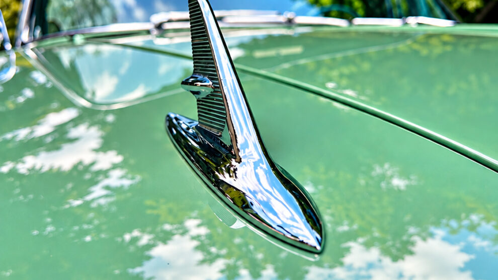 Chrome hood ornament on a vintage green car photographed during a short photography outing